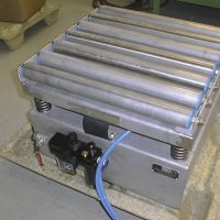 A small roller compaction table compacts boxes of powder as they are packaged. The drive is a lubrication-free NTK<SUP>®</SUP> 25 AL Oscillator.